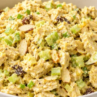 Creamy Curry Chicken Salad - Curry chicken salad: Whip up this zesty and creamy salad in under 30 minutes. Packed with tender chicken, crunchy celery, and a hin