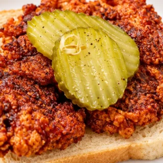 Nashville Hot Chicken Recipe - Hot chicken: bake this spicy, crispy chicken in under 1 hour. Features a cayenne and pickle juice marinade for authentic Nashvill