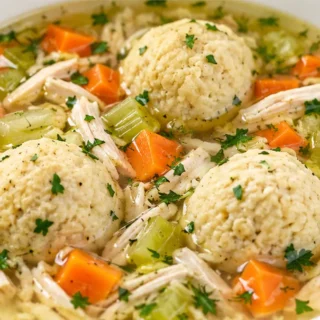 Matzo Ball Soup Recipe - Make the best Matzo Ball Soup! This comforting recipe features tender chicken, flavorful broth, and perfectly fluffy matzo balls. Easy